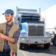 Truck driver looking at a tablet