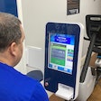 An on-site Fit to Pass health bot in Gulf Relay's gym measures blood pressure, weight and other health indicators. Participants in the weight loss program can keep up with their progress in a supporting app.