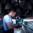 man looking at analytics on laptop