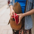 woman opening her wallet