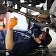 a mechanic conducting an oil change