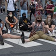 Protestors sitting in a crosswalk and blocking traffic on May 30, 2020