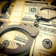 fraud money handcuffs